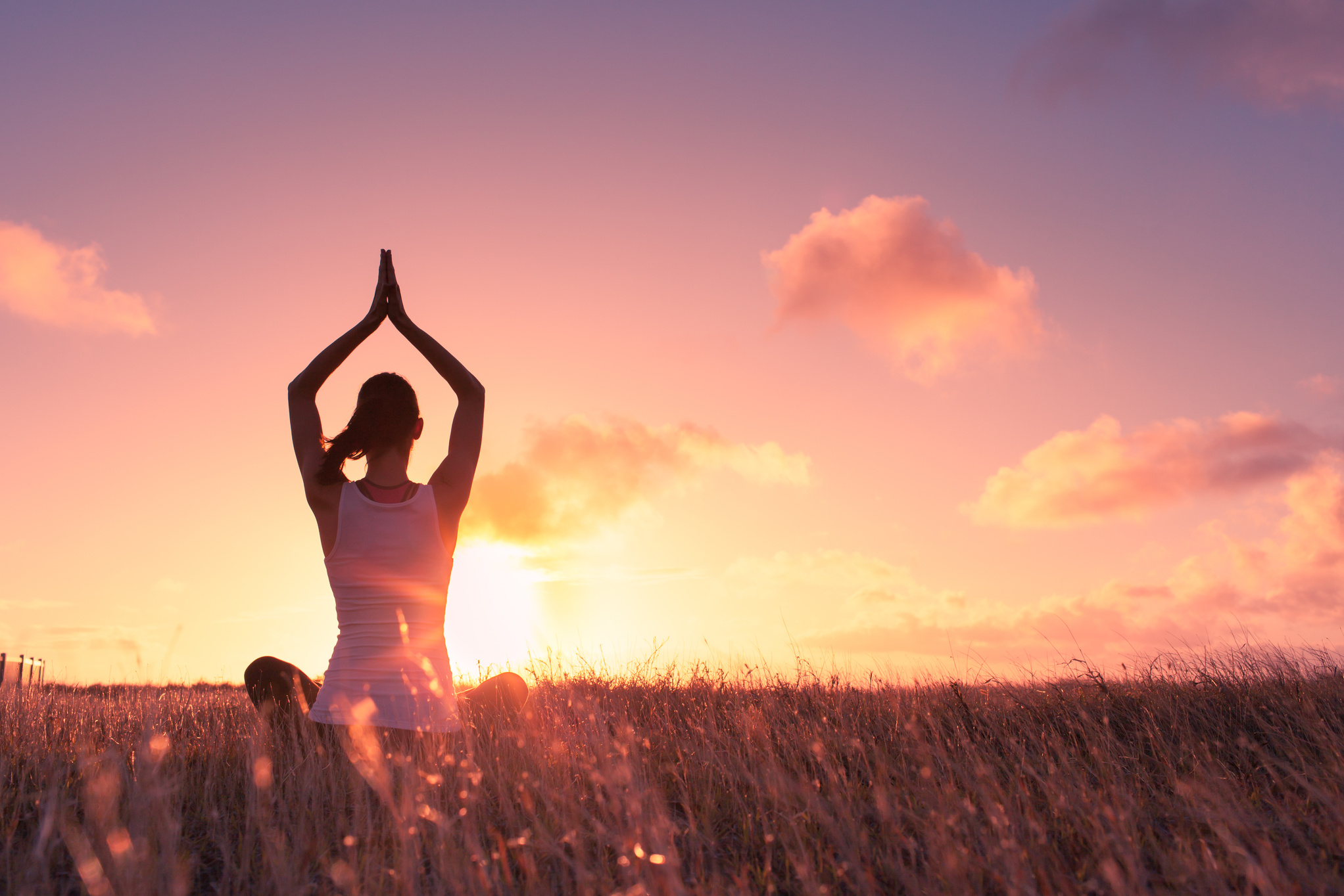 Woman meditating outdoors