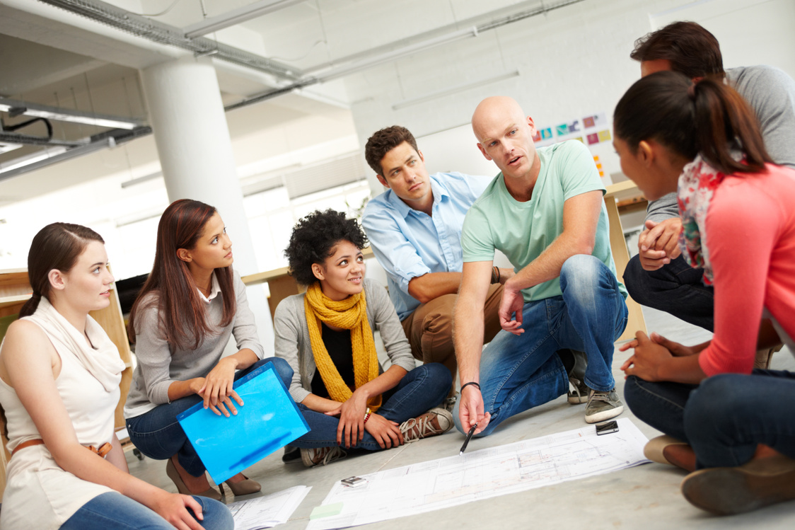 Dynamic Designers. a Group of Multi-Ethnic Creatives Huddled Tog